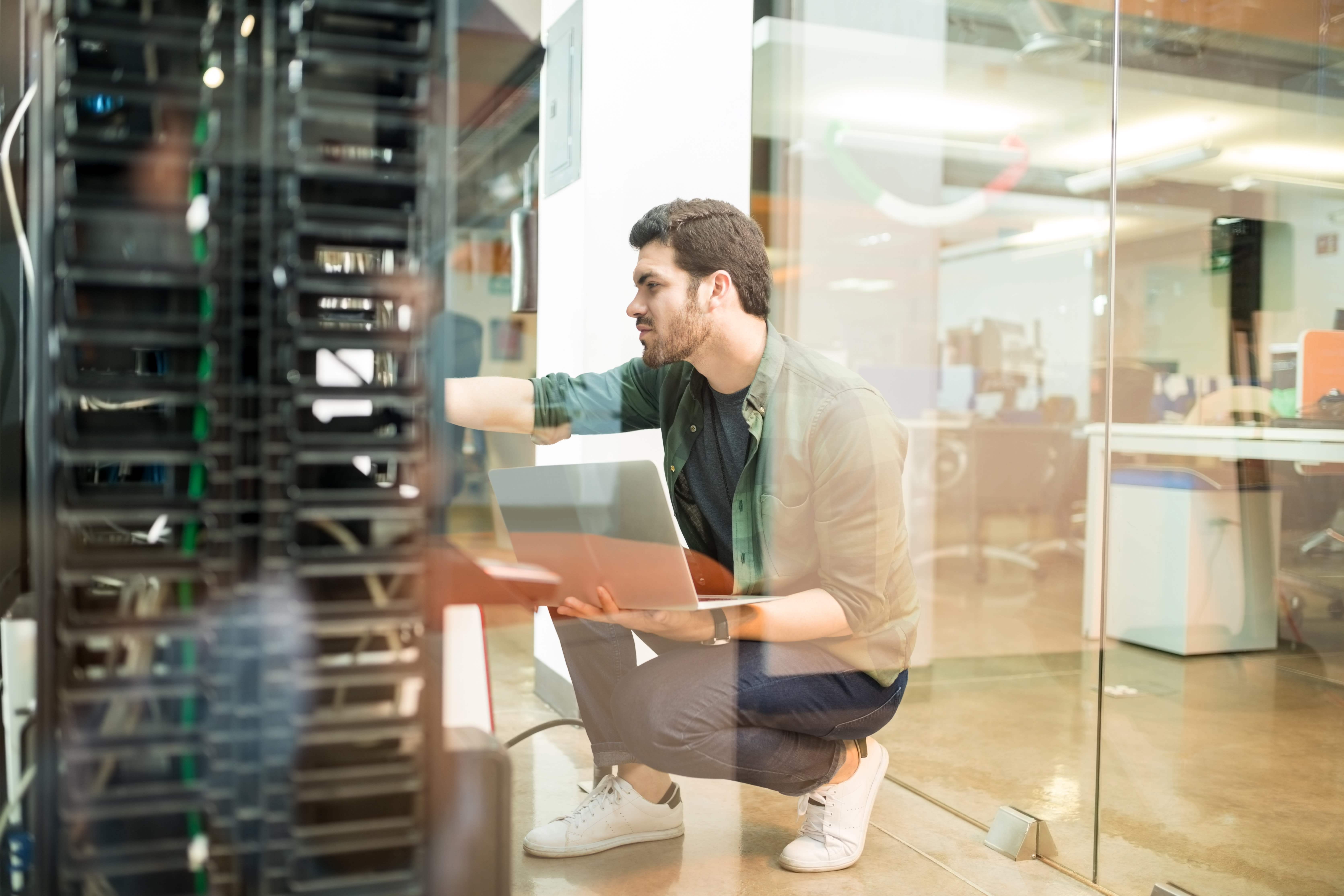 guy-working-in-a-server-room-3x2